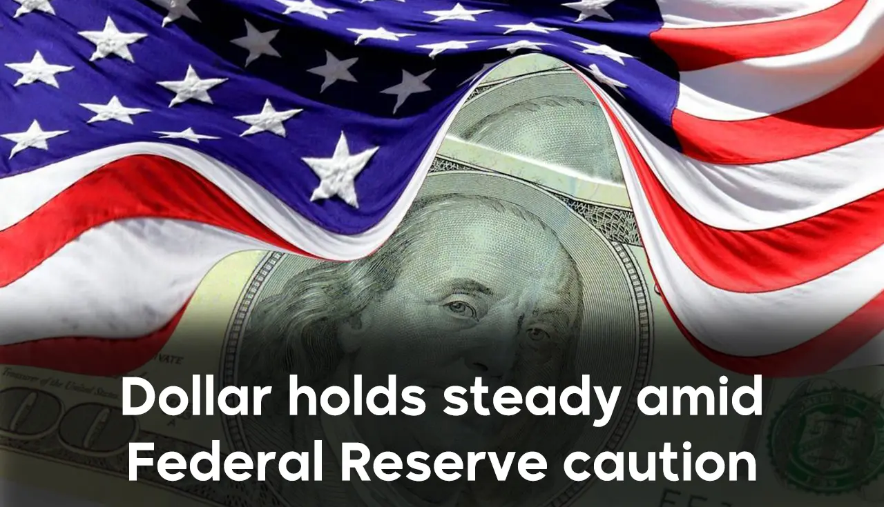 Dollar holds steady amid Federal Reserve caution